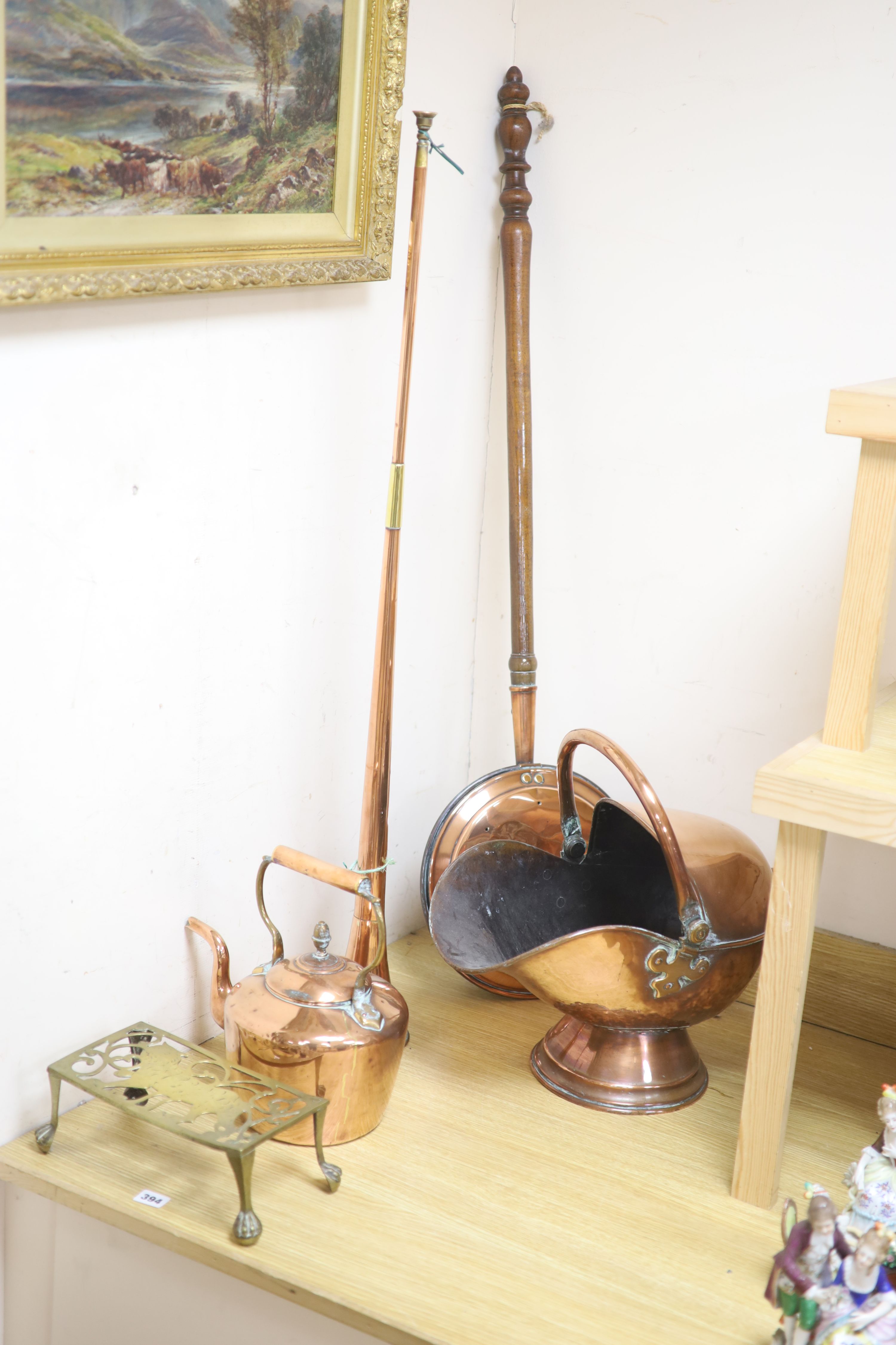 A Victorian copper coal helmet, A Victorian copper kettle, a Victorian copper coaching horn and sundry metalware